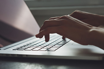 Image showing woman\'s hands working on laptop computer