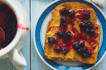 Image showing Sandwich with peanut butter and black currant jam