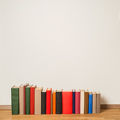 Image showing Old books on wooden floor