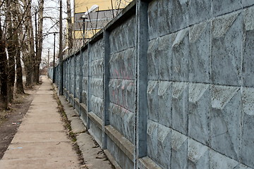 Image showing  dreary road along the prison wall