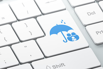 Image showing Safety concept: Family And Umbrella on computer keyboard background