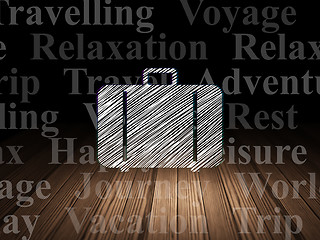 Image showing Tourism concept: Bag in grunge dark room