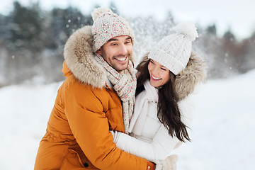 Image showing happy couple hugging and laughing in winter