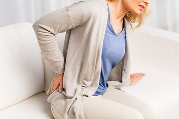 Image showing close up of woman suffering from backache at home