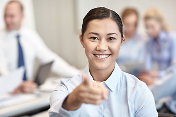 Image showing group of smiling businesspeople meeting in office