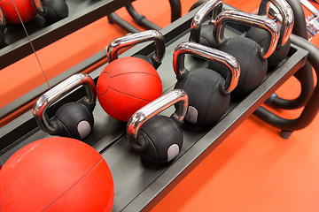 Image showing close up of kettlebells and medicine ball in gym