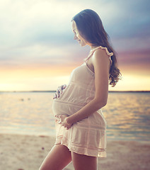 Image showing happy pregnant woman in chemise