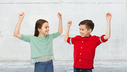 Image showing happy boy and girl celebrating victory