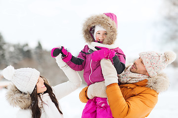 Image showing happy family with child in winter clothes outdoors