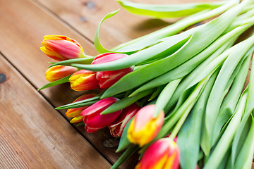 Image showing close up of tulip flowers on wooden table