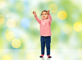 Image showing little baby girl playing with soap bubble