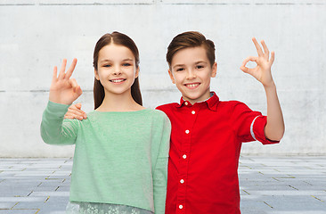 Image showing happy boy and girl showing ok hand sign