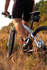 Image showing cyclist riding mountain bike on rocky trail