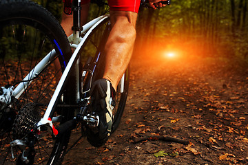 Image showing cyclist man legs riding mountain bike