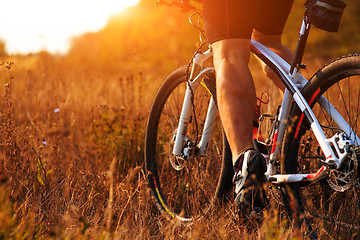 Image showing cyclist man legs riding mountain bike outdoor