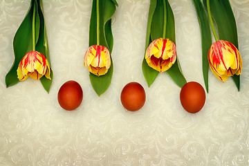 Image showing Three Easter eggs and tulips.