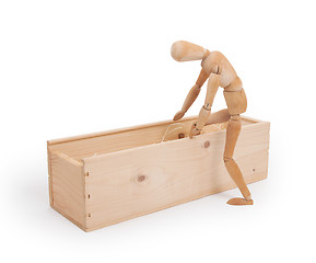 Image showing Wood figure mannequin stepping in a wooden box