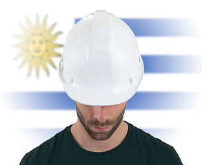 Image showing Engineer with flag on background - Uruguay