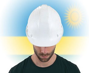 Image showing Engineer with flag on background - Rwanda