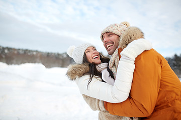 Image showing happy couple hugging outdoors in winter