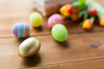Image showing close up of colored easter eggs and flowers