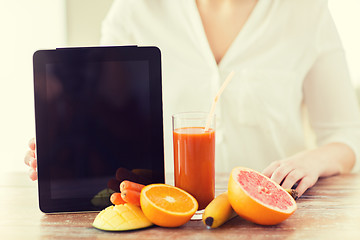 Image showing close up of woman hands with juice and fruits