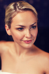 Image showing close up of young woman sitting in bath towel