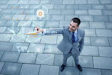 Image showing young smiling businessman outdoors from top