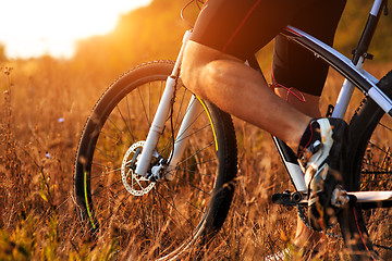 Image showing cyclist man legs riding mountain bike outdoor