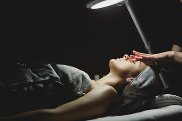 Image showing Close-up of young woman with facial mask