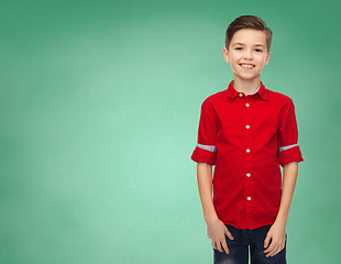 Image showing happy boy over green school chalk board