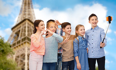 Image showing kids and smartphone selfie stick over eiffel tower