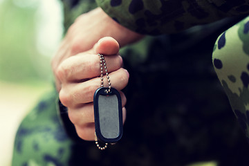 Image showing close up of young soldier in military uniform