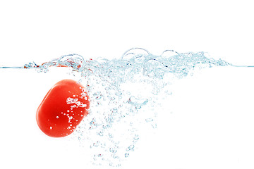 Image showing tomato falling or dipping in water with splash