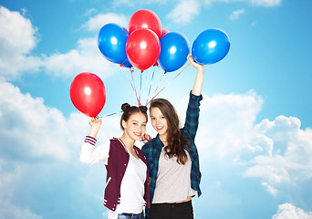 Image showing happy teenage girls with helium balloons