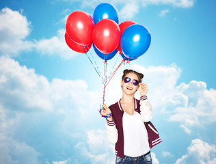 Image showing happy teenage girl with helium balloons