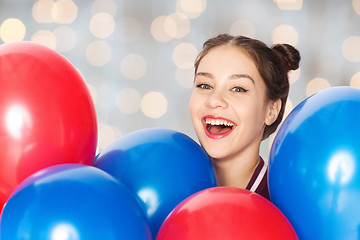 Image showing happy teenage girl with helium balloons