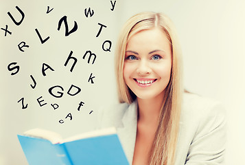 Image showing young woman reading book