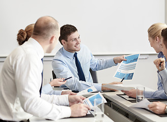 Image showing business people with papers meeting in office