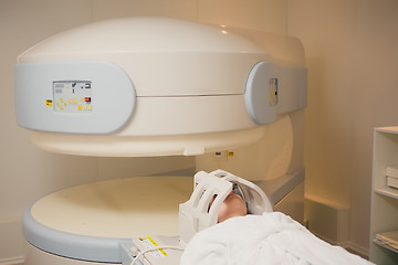 Image showing Patient being scanned and diagnosed on a computed tomography