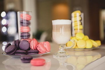 Image showing Cup coffee in hotel with macaroons