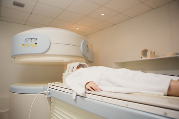 Image showing Patient being scanned and diagnosed on a computed tomography