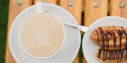 Image showing Morning coffee. Cup coffee in park