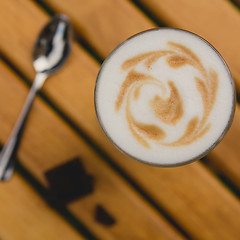 Image showing Morning coffee. Cup coffee in park