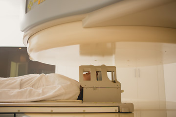 Image showing Patient being scanned and diagnosed on a computed tomography