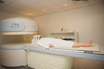 Image showing Patient being scanned and diagnosed on a computed tomography