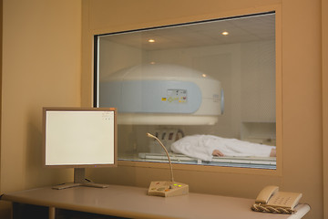 Image showing Patient being scanned and diagnosed on a computed tomography