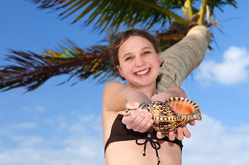 Image showing Young girl with seashell