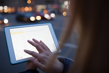 Image showing Woman touching tablet screen