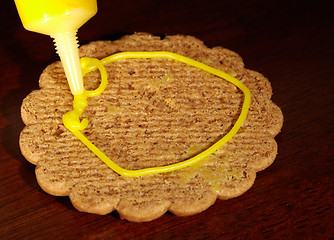 Image showing Drawing on ginger cookies.